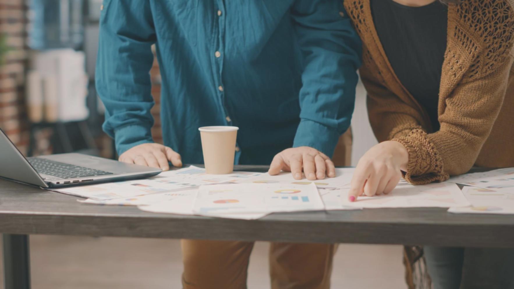 Professional studying budget audit documents and financial records